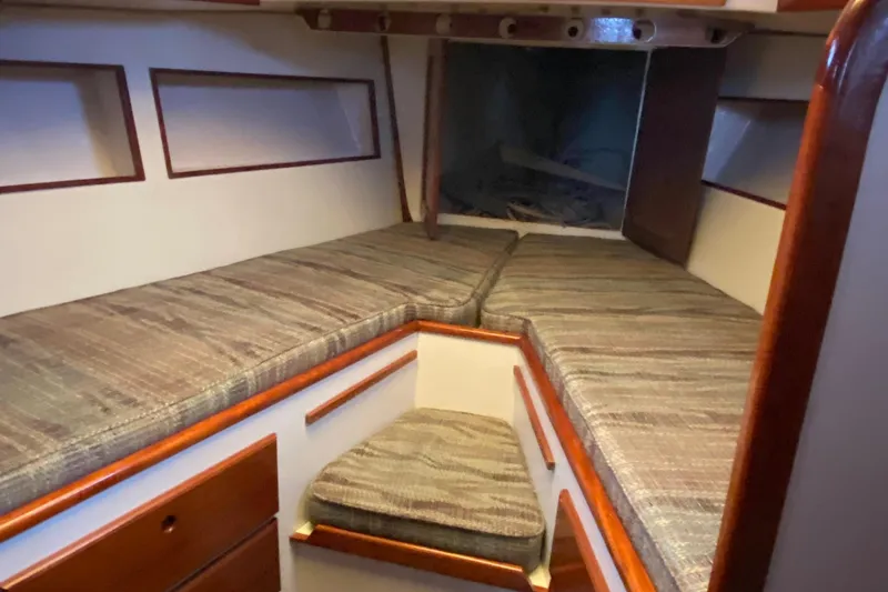 Slide: The Image of Interior cabin of a 1972 Bristol 40 sailboat with cushioned seating. - 56