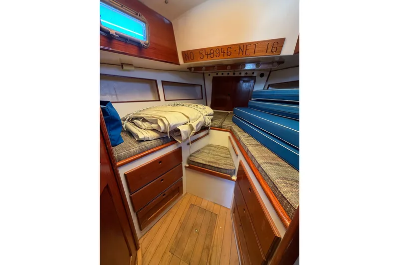 Slide: The Image of 1972 Bristol 40 yacht interior with wooden cabinetry and cozy sleeping area. - 65