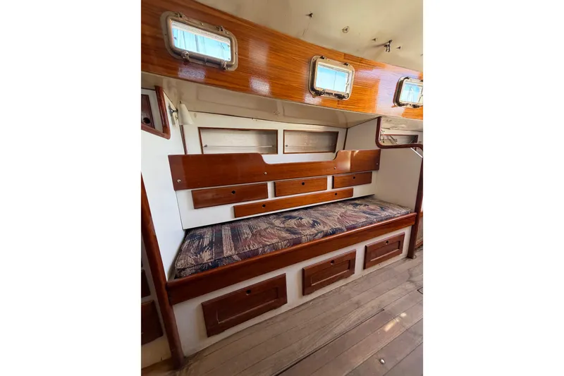 Slide: The Image of 1972 Bristol 40 yacht interior with wooden cabinetry and cushioned seating. - 71