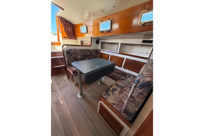 Slide: The Image of 1972 Bristol 40 yacht interior with wooden finish and cozy seating area. - 73