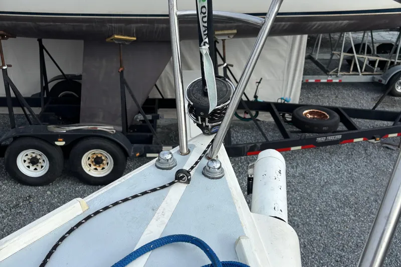 Slide: The Image of Bow of a 1993 J Boats J/80 sailboat with trailer in background. - 21