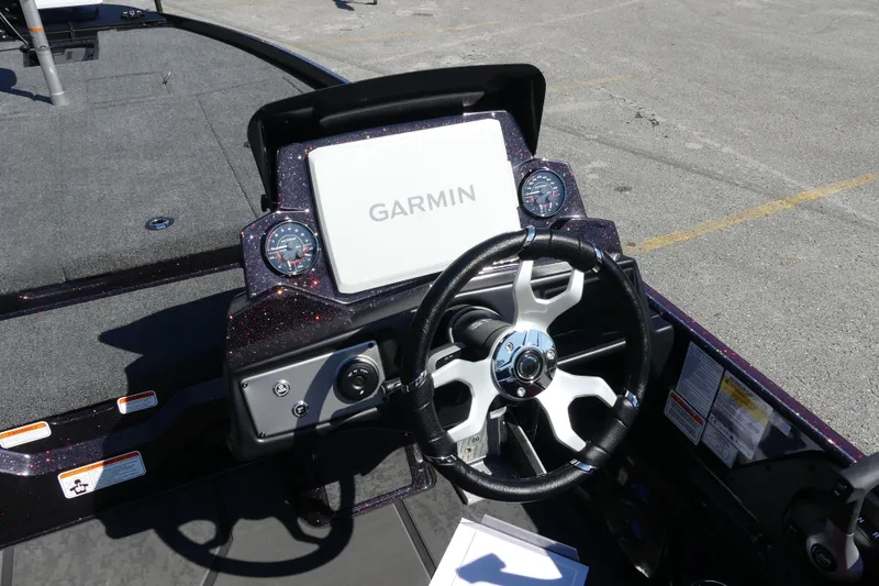 Slide: The Image of 2026 Nitro Z21 XL Pro boat dashboard with Garmin display and steering wheel. - 81