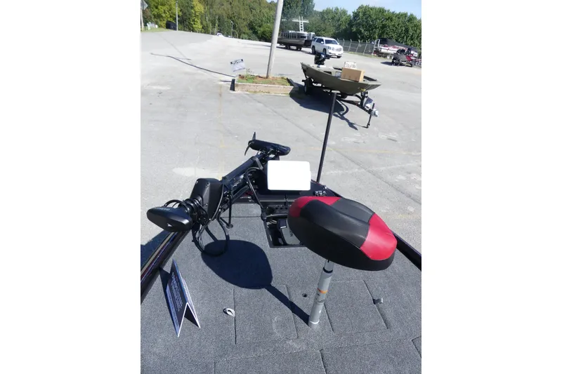 Slide: The Image of 2026 Nitro Z21 XL Pro boat interior with red and black seat, steering controls. - 88