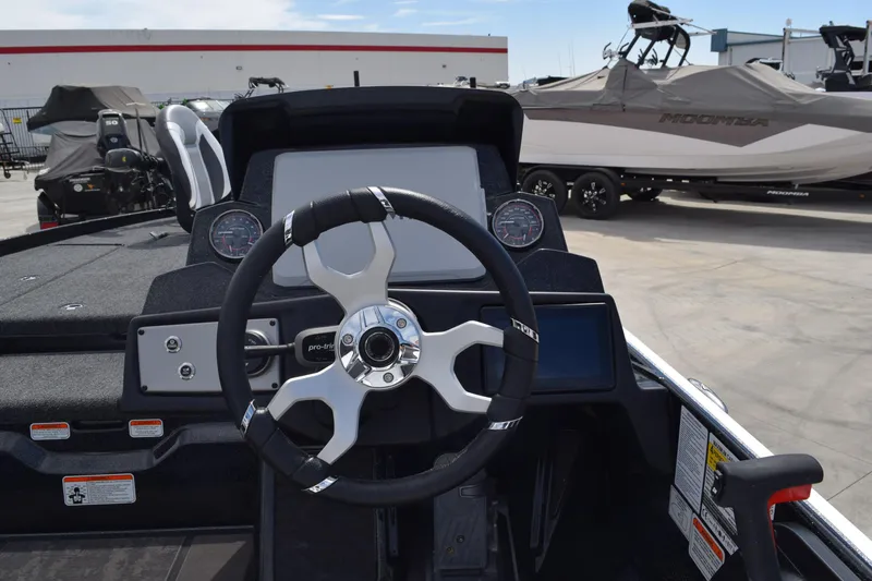 Slide: The Image of 2026 Nitro Z21 XL Pro boat dashboard with steering wheel and gauges. - 3