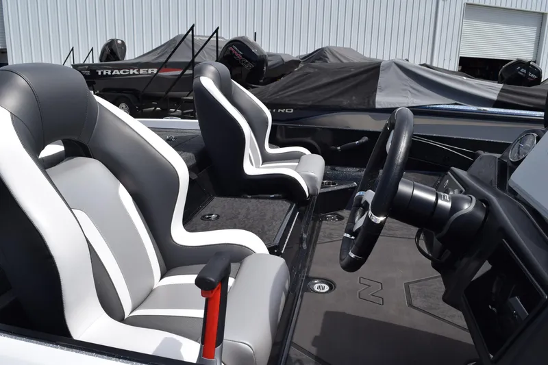 Slide: The Image of 2026 Nitro Z21 XL Pro boat interior with sleek seats and steering wheel. - 5