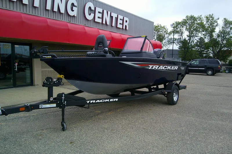Slide: The Image of 2026 Tracker Pro Guide V-175 WT boat on trailer outside dealership. - 72