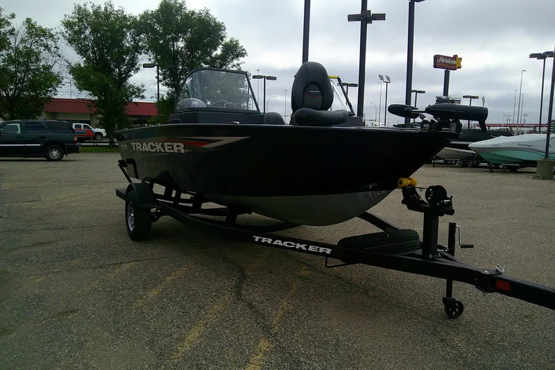 Slide: The Image of 2026 Tracker Pro Guide V-175 WT boat on trailer in parking lot. - 73