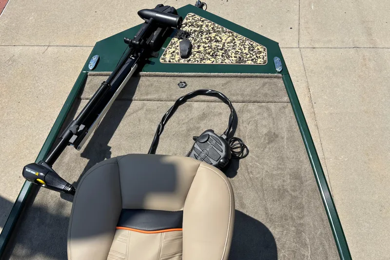 Slide: The Image of 2026 Tracker Bass Tracker Classic Limited boat deck with seat and trolling motor. - 3