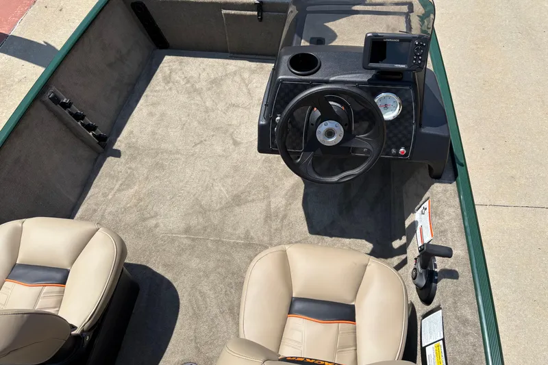 Slide: The Image of 2026 Tracker Bass Tracker Classic Limited boat interior with steering wheel and seats. - 5