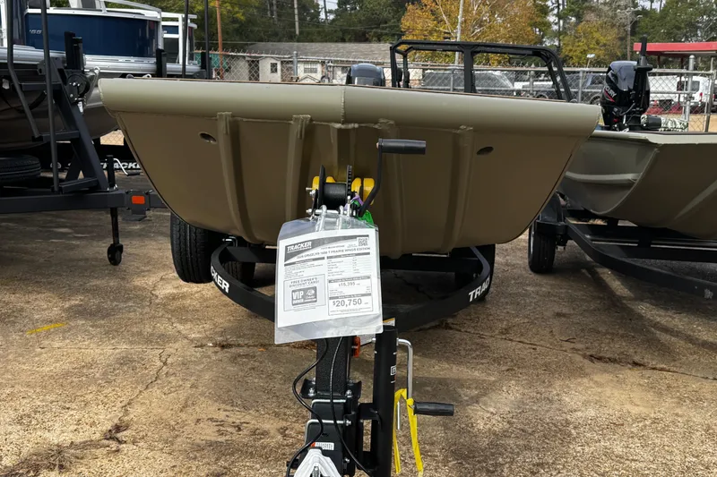 Slide: The Image of 2026 Tracker Grizzly 1650 T Prairie Wings Edition boat on display in a dealership. - 24