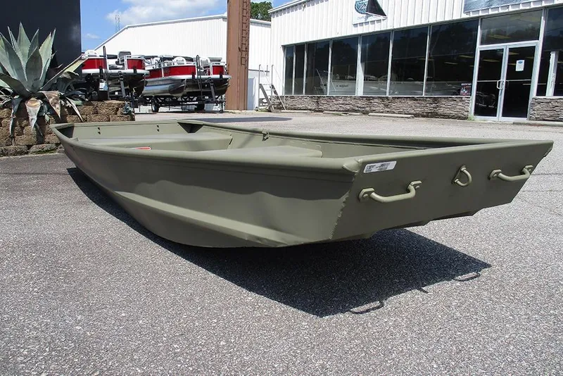Slide: The Image of 2026 Tracker Grizzly 12 Jon boat in outdoor showroom, showcasing durable design. - 3