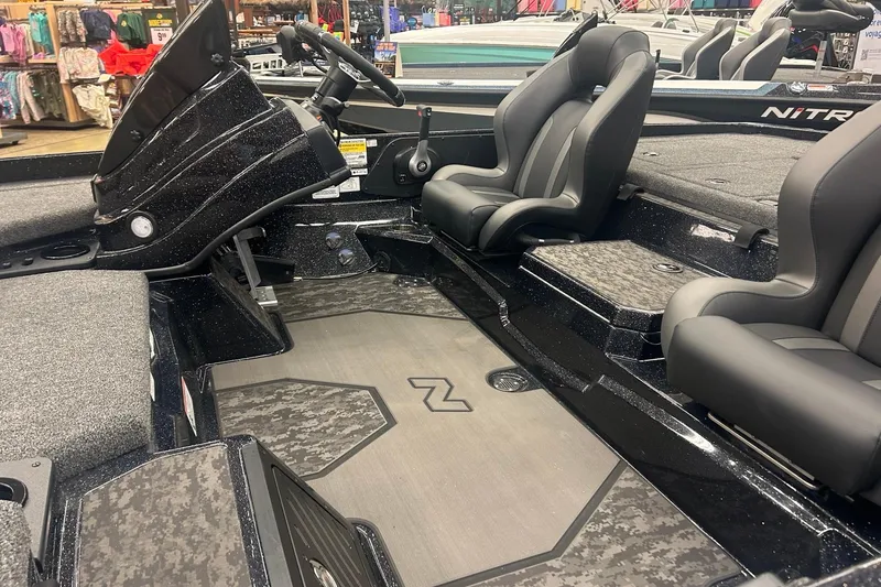 Slide: The Image of 2026 Nitro Z21 XL Pro boat interior with sleek seating and modern dashboard design. - 85