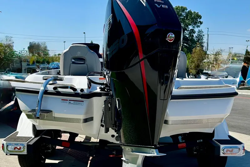 Slide: The Image of 2026 Nitro Z21 XL Pro boat with powerful V8 engine, parked outdoors. - 2