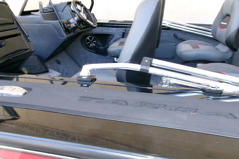 Slide: The Image of 2026 Tracker Targa V-18 WT boat interior with steering wheel and seating. - 14
