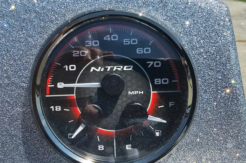 Slide: The Image of Close-up of a Nitro Z18 Pro 2026 speedometer, displaying speed in MPH. - 10