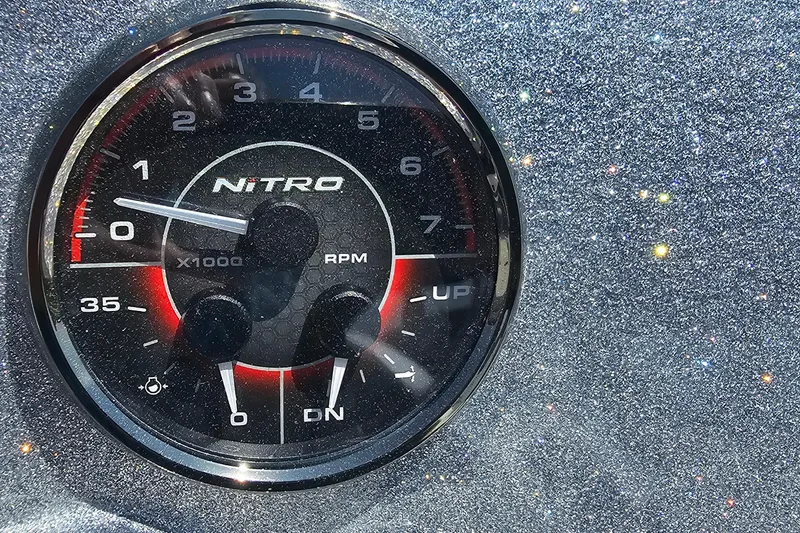 Slide: The Image of Close-up of Nitro Z18 Pro 2026 RPM gauge on glittery dashboard. - 9