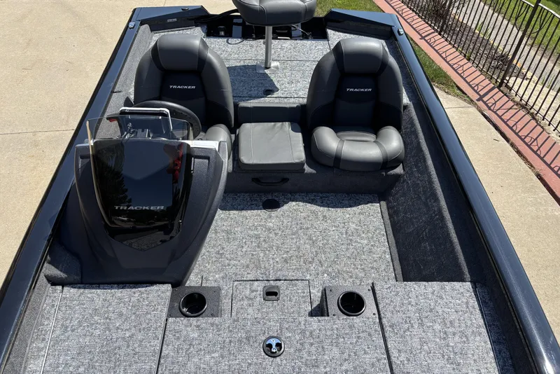 Slide: The Image of 2026 Tracker Pro Team 175 boat interior with dual seats and console, featuring gray upholstery. - 4