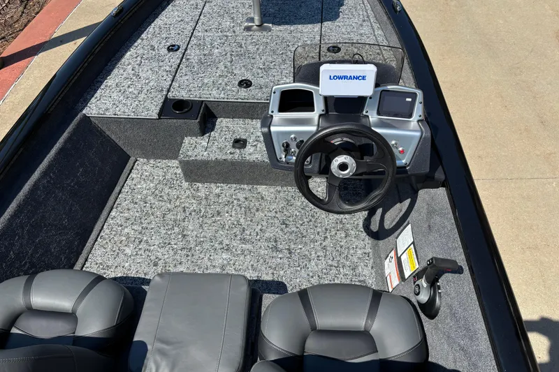 Slide: The Image of 2026 Tracker Pro Team 175 boat interior with steering wheel and control panel. - 5
