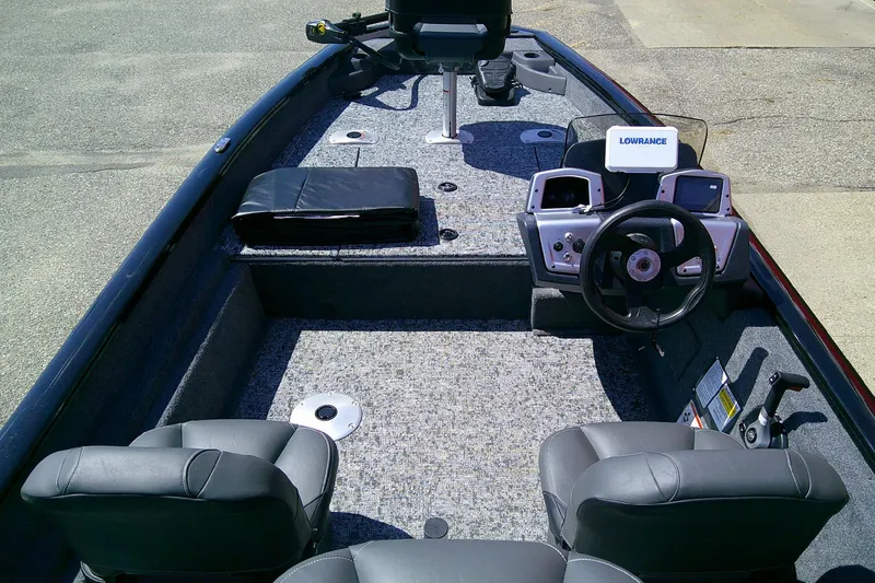 Slide: The Image of 2026 Tracker Pro Team 175 Crappie Edition boat interior with steering console and seating. - 4