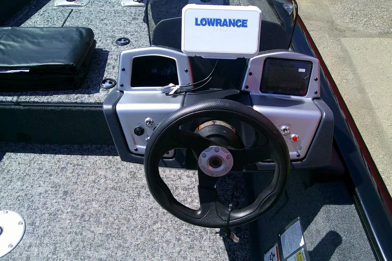 Slide: The Image of 2026 Tracker Pro Team 175 Crappie Edition boat dashboard with steering wheel and Lowrance Eagle display. - 5