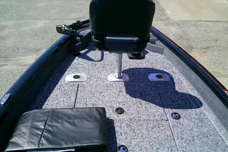 Slide: The Image of 2026 Tracker Pro Team 175 Crappie Edition boat interior with seating and carpeted deck. - 6
