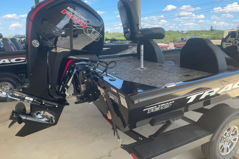 Slide: The Image of 2026 Tracker Pro Team 190 boat with Mercury Pro XS engine, parked outdoors. - 3