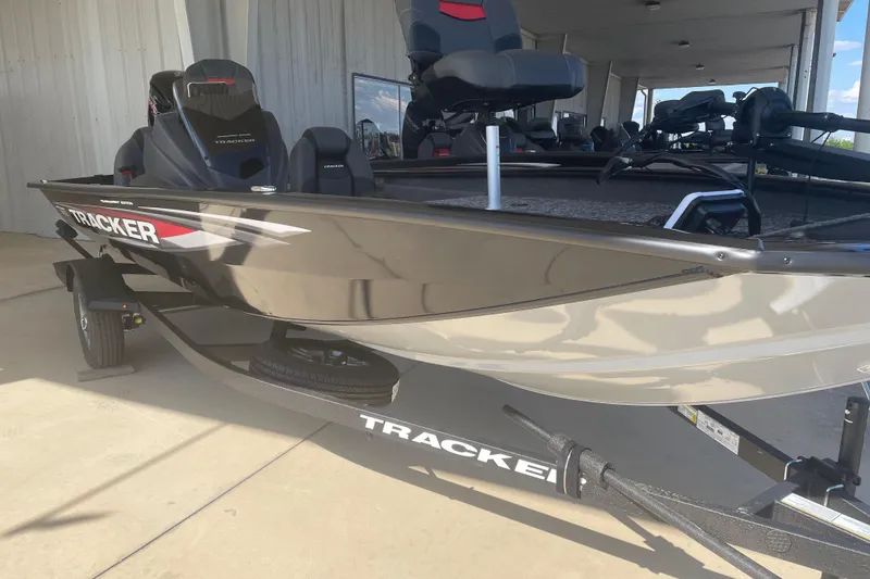 Slide: The Image of 2026 Tracker Pro Team 190 boat on trailer, displayed in a showroom. - 4