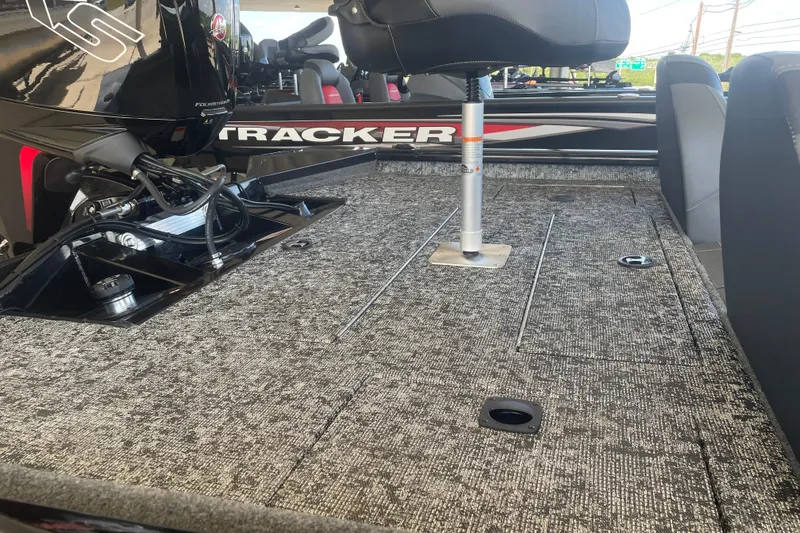 Slide: The Image of 2026 Tracker Pro Team 190 boat interior with carpeted deck and seating. - 5