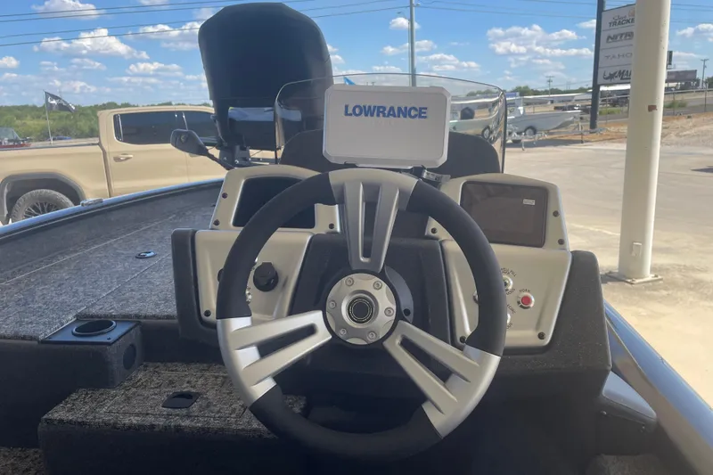 Slide: The Image of 2026 Tracker Pro Team 190 boat dashboard with steering wheel and Lowrance display. - 6