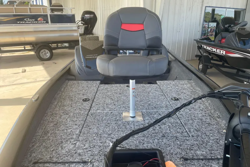 Slide: The Image of 2026 Tracker Pro Team 190 boat interior with seating and carpeted deck. - 8