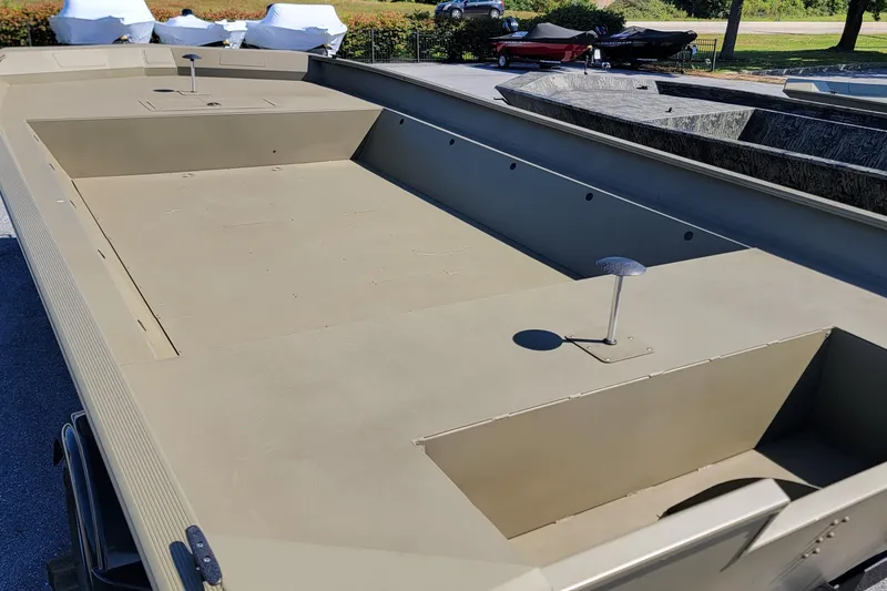 Slide: The Image of 2026 Tracker GRIZZLY 2072 Utility boat, spacious deck, parked outdoors. - 2