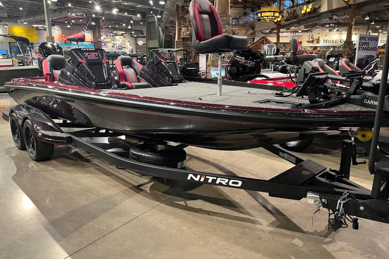 The Image of 2026 Nitro Z21 XL Pro bass boat displayed in a showroom with sleek design and modern features. - 0