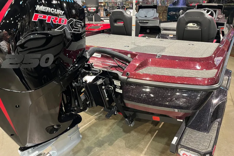 Slide: The Image of 2026 Nitro Z21 XL Pro boat with Mercury Pro XS 250 engine, red and black design. - 2