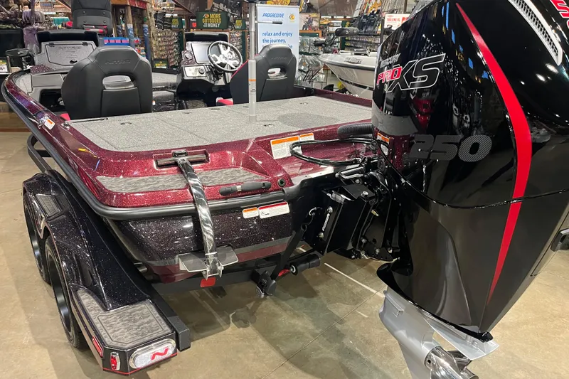 Slide: The Image of 2026 Nitro Z21 XL Pro boat with Mercury Pro XS 250 engine displayed indoors. - 3