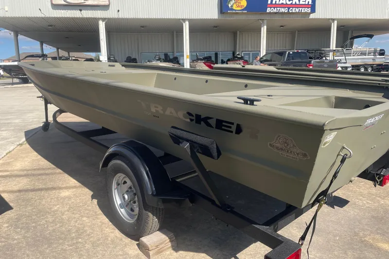 Slide: The Image of 2026 Tracker Grizzly 1754 Utility boat on trailer at dealership. - 4
