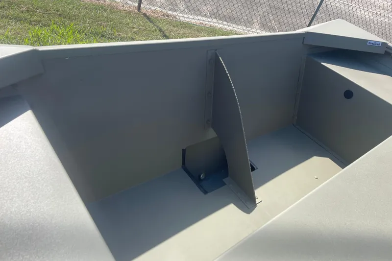 Slide: The Image of Interior view of 2026 Tracker Grizzly 1754 Utility boat, showcasing storage compartment. - 5