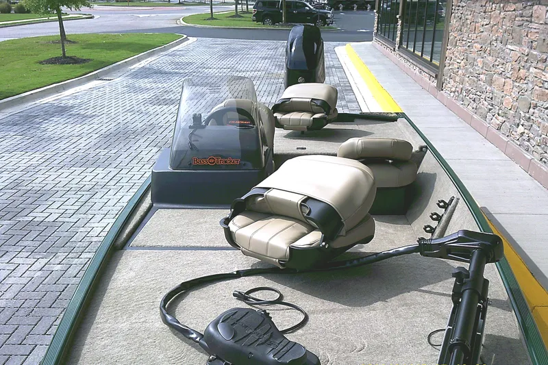 Slide: The Image of 2026 Tracker Bass Tracker Classic Limited boat with beige seats and trolling motor. - 5