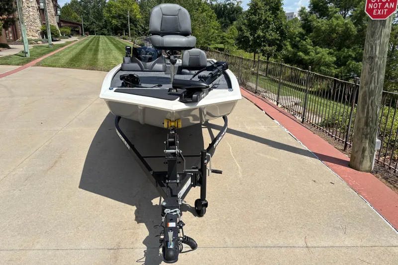 Slide: The Image of 2026 Tracker Pro 170 boat on trailer, parked on a sunny driveway. - 2