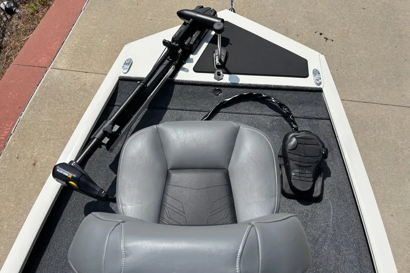 Slide: The Image of 2026 Tracker Pro 170 boat interior with gray seat and trolling motor. - 3