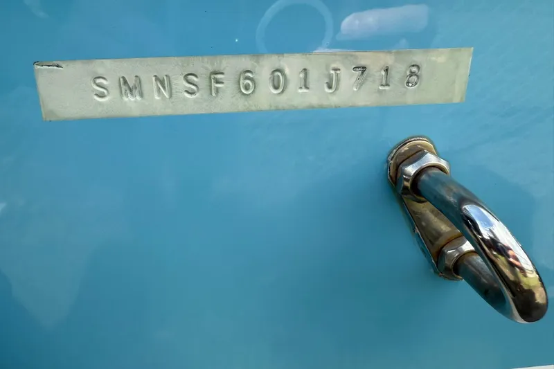 Slide: The Image of 2018 Sportsman Open 232 Center Console hull identification number and handle. - 12