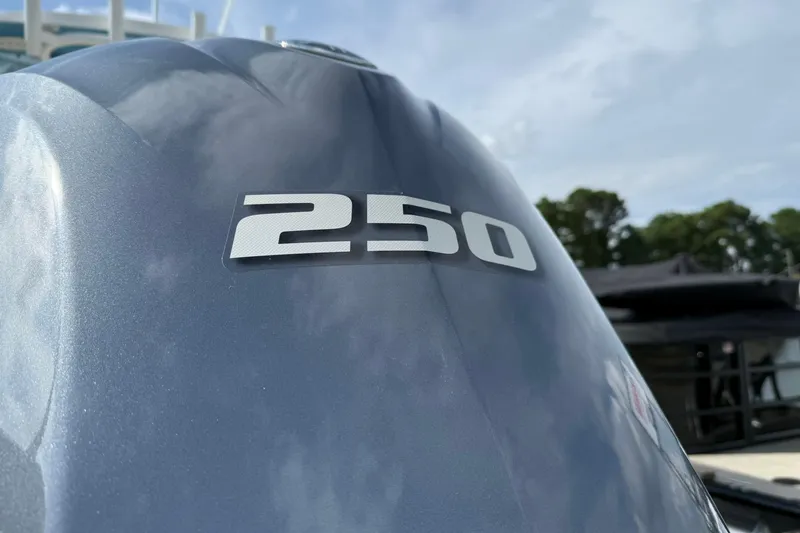 Slide: The Image of Close-up of a 250 horsepower engine on a 2018 Sportsman Open 232 Center Console boat. - 14