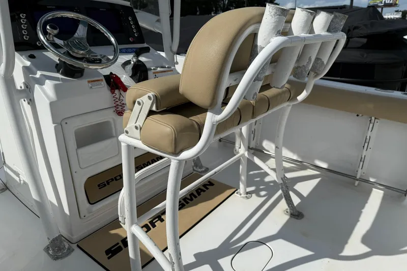 Slide: The Image of 2018 Sportsman Open 232 Center Console boat interior with helm and seating. - 4