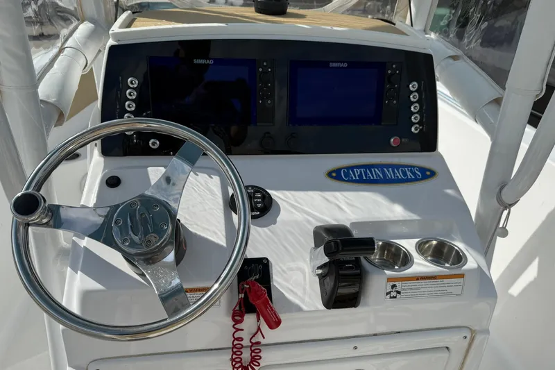 Slide: The Image of 2018 Sportsman Open 232 Center Console dashboard with steering wheel and navigation screens. - 5