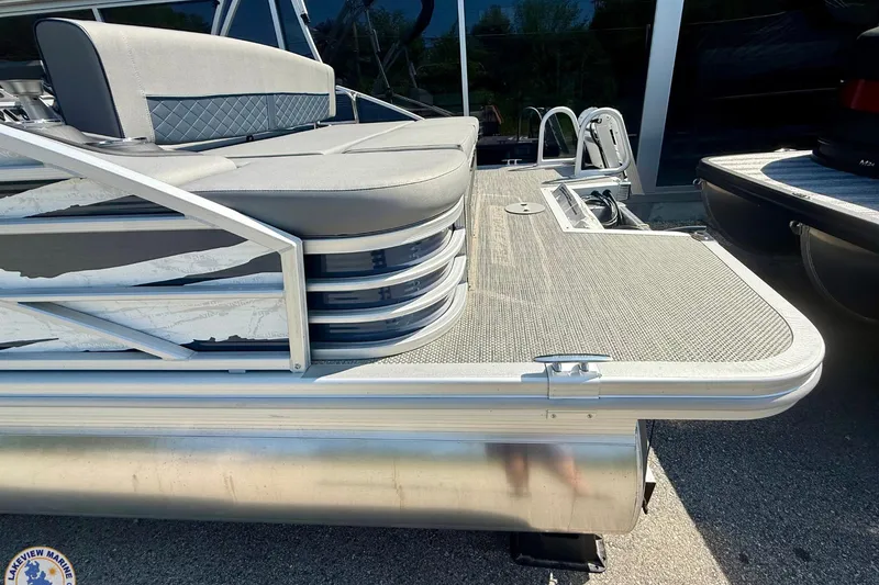 Slide: The Image of 2024 Bennington 22 LSB pontoon boat with sleek seating and modern design. - 2