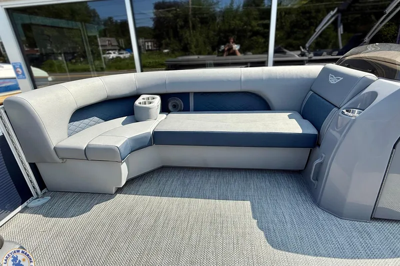 Slide: The Image of 2024 Bennington 22 LSB pontoon boat interior with plush seating and cup holders. - 4