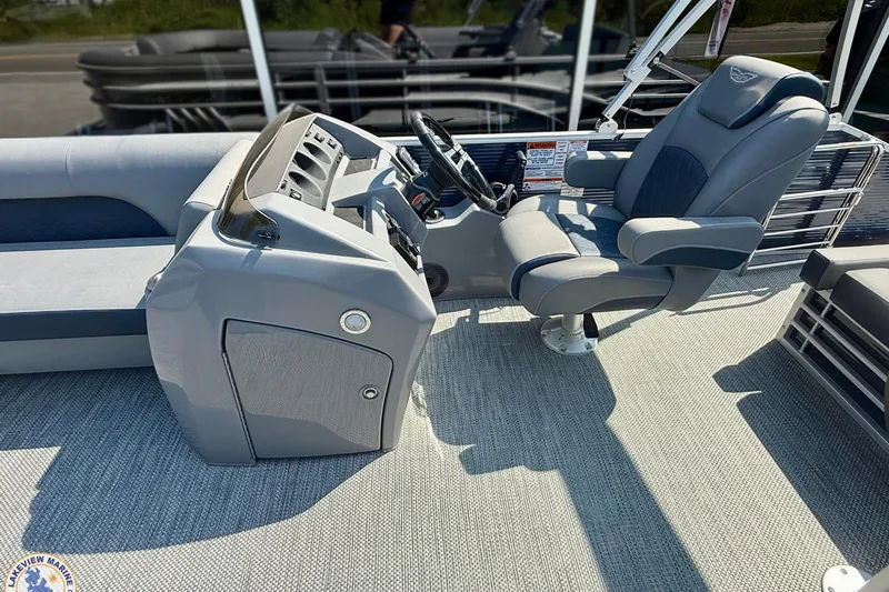 Slide: The Image of 2024 Bennington 22 LSB boat interior with steering console and captain's chair. - 6
