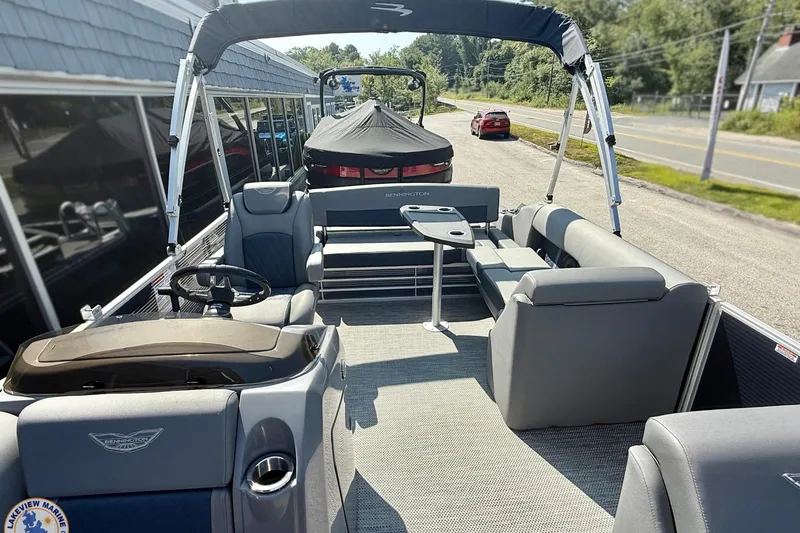 Slide: The Image of 2024 Bennington 22 LSB pontoon boat with spacious seating and modern design. - 8