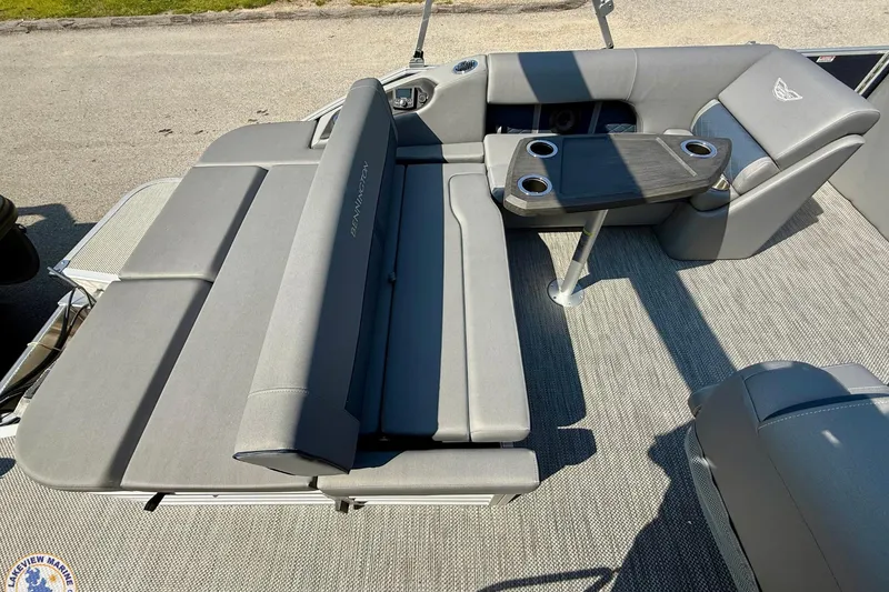 Slide: The Image of 2024 Bennington 22 LSB boat interior with gray seating and table. - 9