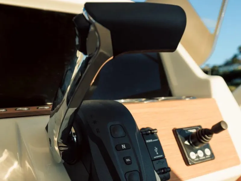 Slide: The Image of Close-up of throttle control on a 2025 Axopar AX/E 22 T-Top. - 6