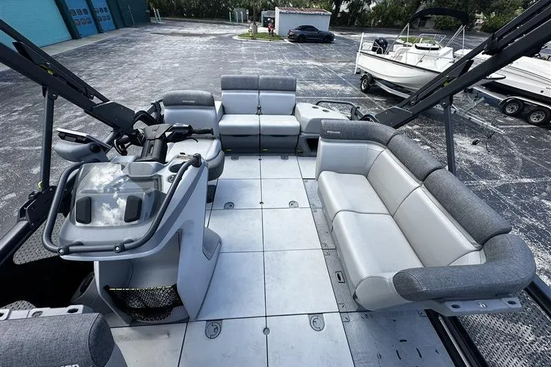 Slide: The Image of 2023 Sea-Doo Switch 16 pontoon boat interior with spacious seating and modern design. - 5